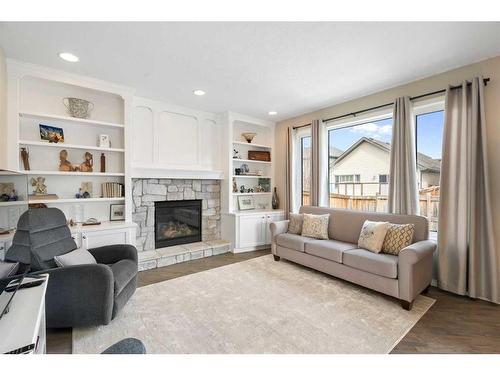 202 Auburn Bay Cove Se, Calgary, AB - Indoor Photo Showing Living Room With Fireplace