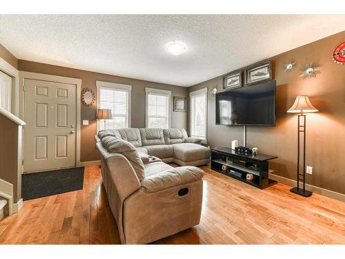 257 Rainbow Falls Manor, Chestermere, AB - Indoor Photo Showing Living Room