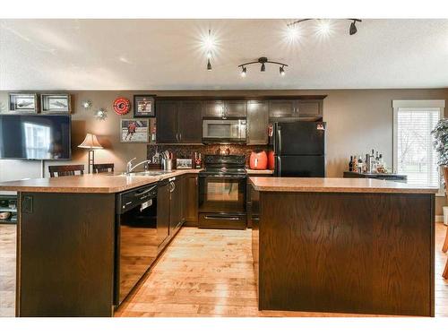 257 Rainbow Falls Manor, Chestermere, AB - Indoor Photo Showing Kitchen