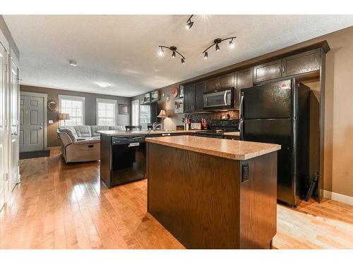 257 Rainbow Falls Manor, Chestermere, AB - Indoor Photo Showing Kitchen