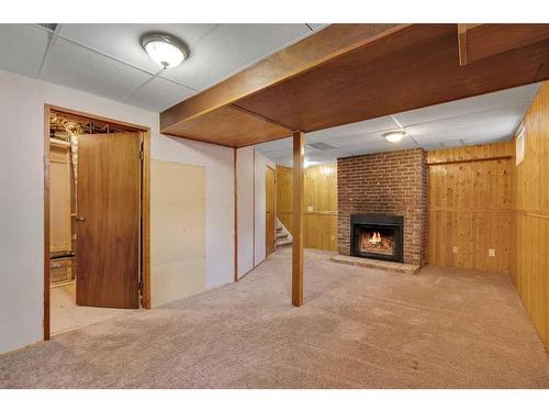 64 Woodview Court Sw, Calgary, AB - Indoor With Fireplace