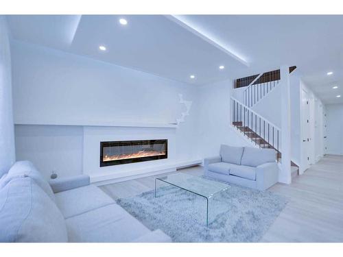 12 Nolanhurst Heights Nw, Calgary, AB - Indoor Photo Showing Living Room With Fireplace