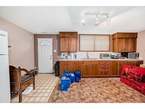 2018 Alexander Street Se, Calgary, AB - Indoor Photo Showing Kitchen With Double Sink