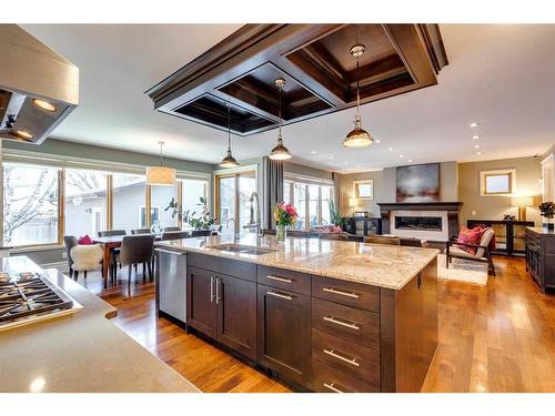 3822 11 Street Sw, Calgary, AB - Indoor Photo Showing Kitchen With Fireplace With Double Sink