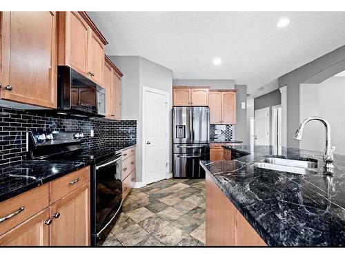 121 Bridleridge Heights Sw, Calgary, AB - Indoor Photo Showing Kitchen With Stainless Steel Kitchen With Double Sink