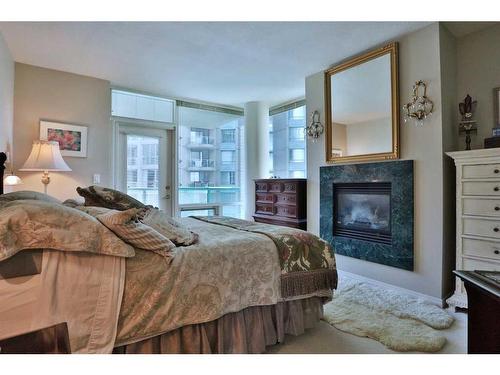 704-837 2 Avenue Sw, Calgary, AB - Indoor Photo Showing Other Room With Fireplace