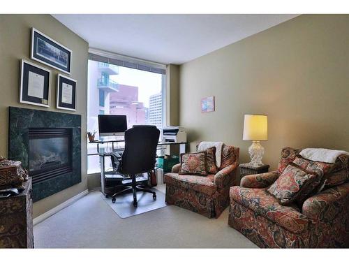 704-837 2 Avenue Sw, Calgary, AB - Indoor Photo Showing Living Room With Fireplace