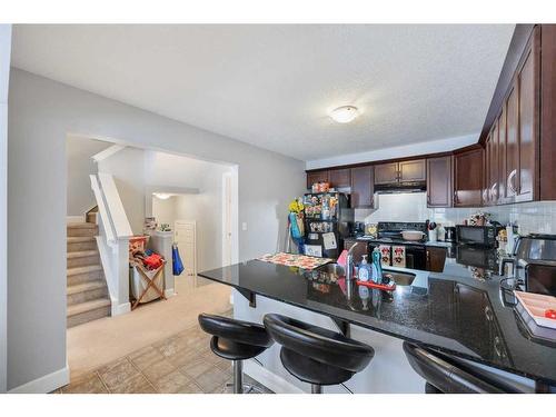 110 Windstone Crescent Sw, Airdrie, AB - Indoor Photo Showing Kitchen With Double Sink