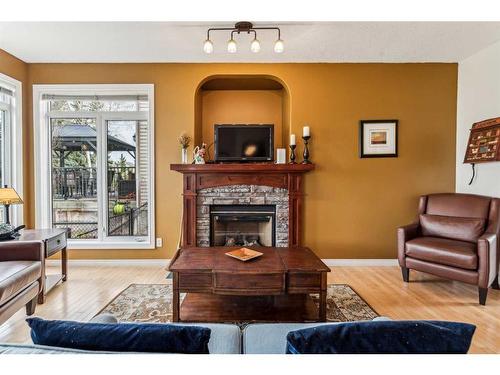 119 Crystal Green Drive, Okotoks, AB - Indoor Photo Showing Living Room With Fireplace