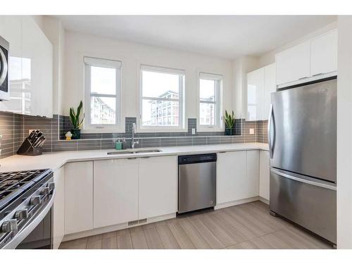13 Walden Common Se, Calgary, AB - Indoor Photo Showing Kitchen With Stainless Steel Kitchen