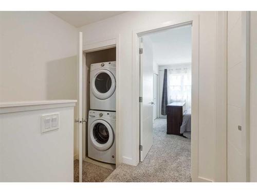 13 Walden Common Se, Calgary, AB - Indoor Photo Showing Laundry Room