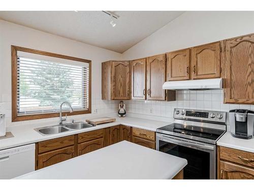 68 Woodford Close Sw, Calgary, AB - Indoor Photo Showing Kitchen With Double Sink