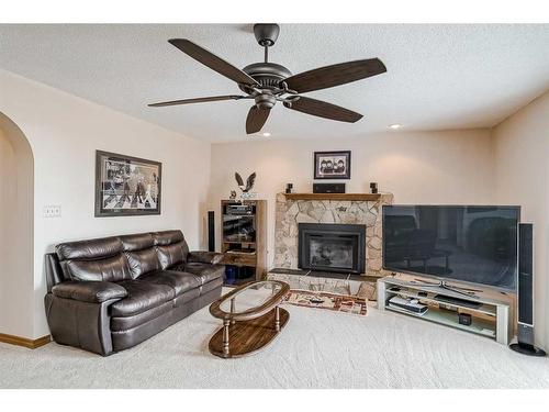 68 Woodford Close Sw, Calgary, AB - Indoor Photo Showing Living Room With Fireplace