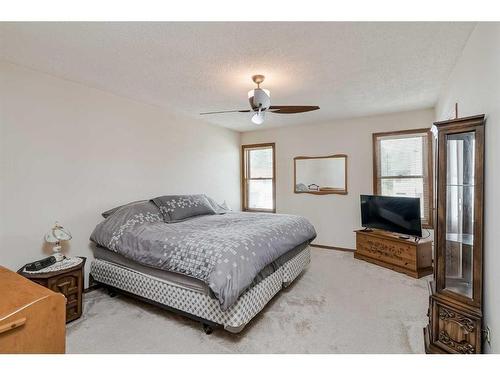 68 Woodford Close Sw, Calgary, AB - Indoor Photo Showing Bedroom