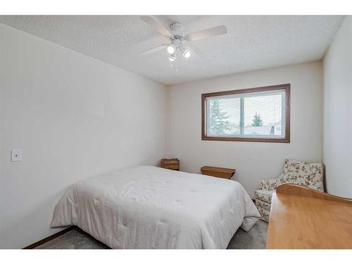 68 Woodford Close Sw, Calgary, AB - Indoor Photo Showing Bedroom