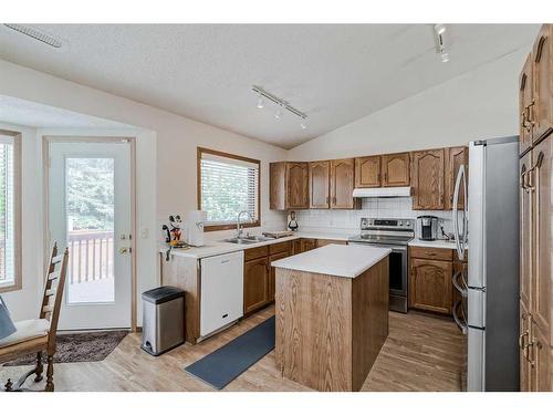68 Woodford Close Sw, Calgary, AB - Indoor Photo Showing Kitchen With Double Sink