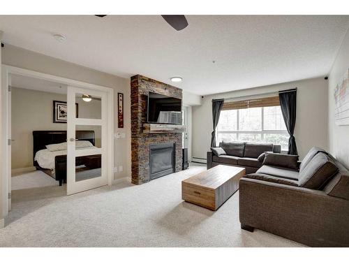 236-35 Richard Court Sw, Calgary, AB - Indoor Photo Showing Living Room With Fireplace