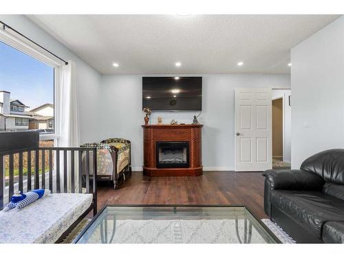 306 Falwood Way Ne, Calgary, AB - Indoor Photo Showing Living Room With Fireplace
