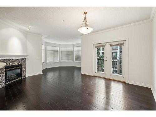 308-59 22 Avenue Sw, Calgary, AB - Indoor Photo Showing Living Room With Fireplace