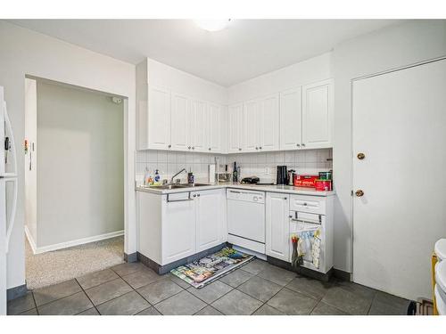 919 32 Avenue Nw, Calgary, AB - Indoor Photo Showing Kitchen With Double Sink