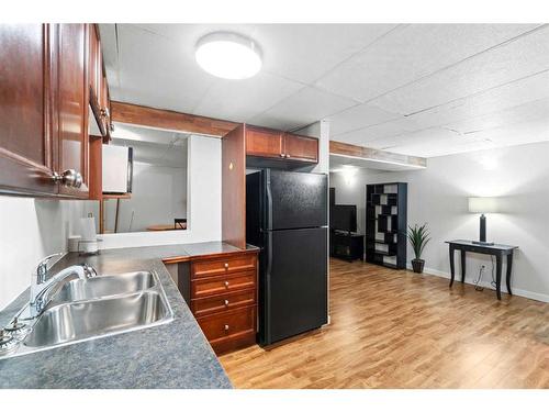 220 Chapala Drive Se, Calgary, AB - Indoor Photo Showing Kitchen With Double Sink