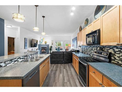 220 Chapala Drive Se, Calgary, AB - Indoor Photo Showing Kitchen With Double Sink