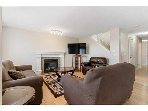 57 Evansdale Landing Nw, Calgary, AB - Indoor Photo Showing Living Room With Fireplace