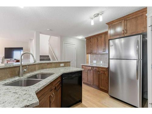 57 Evansdale Landing Nw, Calgary, AB - Indoor Photo Showing Kitchen With Double Sink