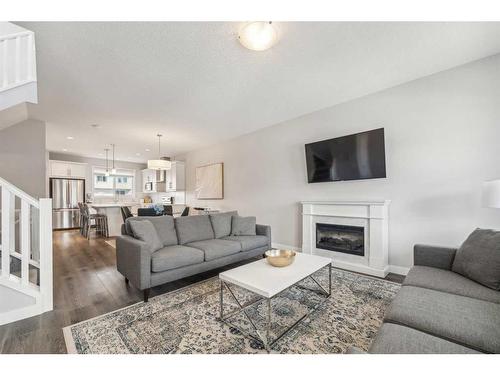63 Legacy Glen Row Se, Calgary, AB - Indoor Photo Showing Living Room With Fireplace