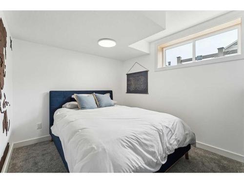 301 Sundown Road, Cochrane, AB - Indoor Photo Showing Bedroom