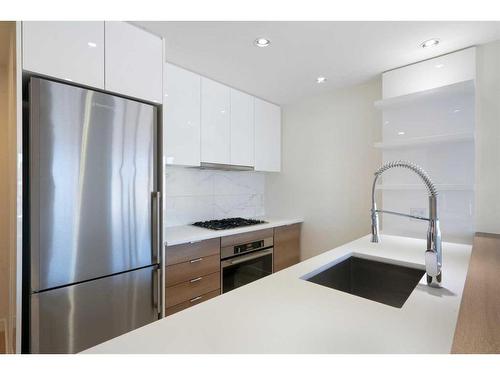 207-138 Waterfront Court Sw, Calgary, AB - Indoor Photo Showing Kitchen With Stainless Steel Kitchen With Upgraded Kitchen
