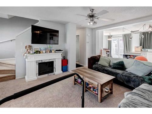 270 Mckenzie Towne Link Se, Calgary, AB - Indoor Photo Showing Living Room With Fireplace