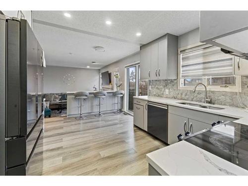 144 Whitlow Place Ne, Calgary, AB - Indoor Photo Showing Kitchen With Double Sink
