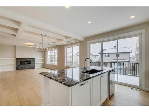 1512 Coopers Point Sw, Airdrie, AB - Indoor Photo Showing Kitchen With Double Sink With Upgraded Kitchen