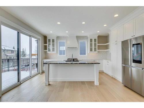 1512 Coopers Point Sw, Airdrie, AB - Indoor Photo Showing Kitchen With Upgraded Kitchen