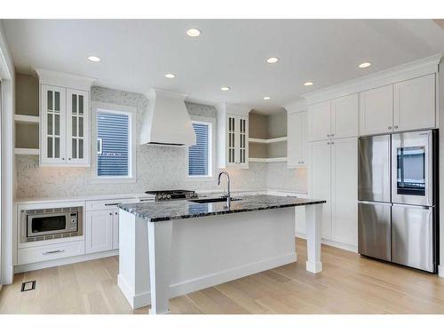 1512 Coopers Point Sw, Airdrie, AB - Indoor Photo Showing Kitchen With Upgraded Kitchen