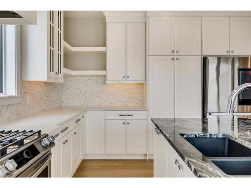 1512 Coopers Point Sw, Airdrie, AB - Indoor Photo Showing Kitchen With Double Sink With Upgraded Kitchen