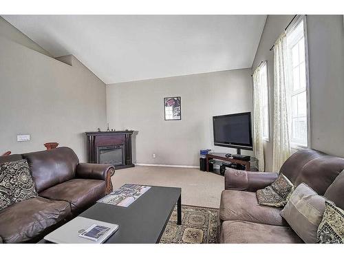 250 Royal Oak Heath Nw, Calgary, AB - Indoor Photo Showing Living Room With Fireplace