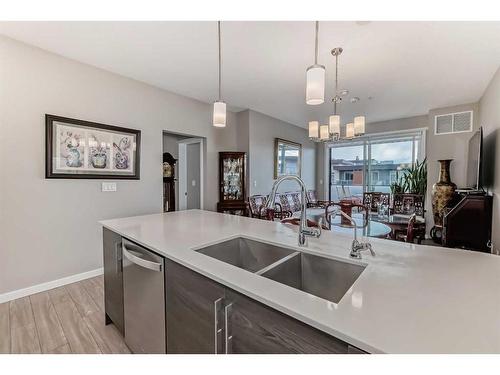 605-122 Mahogany Centre Se, Calgary, AB - Indoor Photo Showing Kitchen With Double Sink