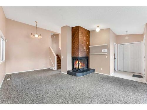 36 Whitehaven Road Ne, Calgary, AB - Indoor With Fireplace