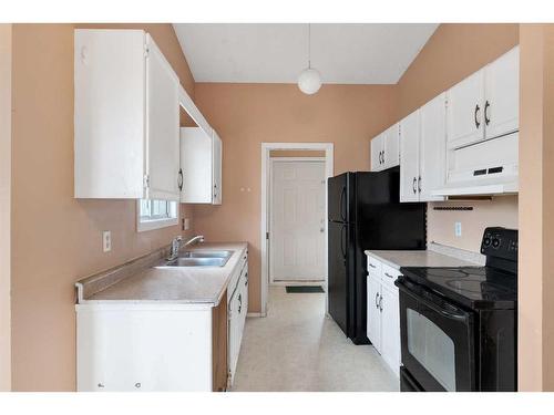 36 Whitehaven Road Ne, Calgary, AB - Indoor Photo Showing Kitchen With Double Sink