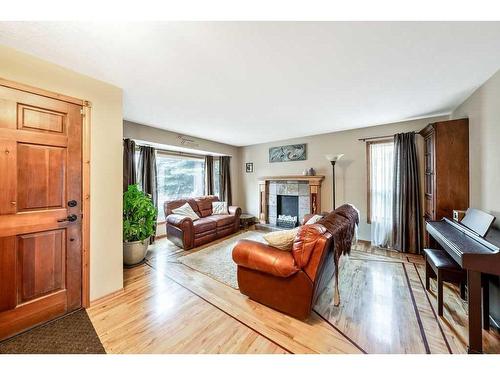 13552 Deer Run Boulevard Se, Calgary, AB - Indoor Photo Showing Living Room With Fireplace