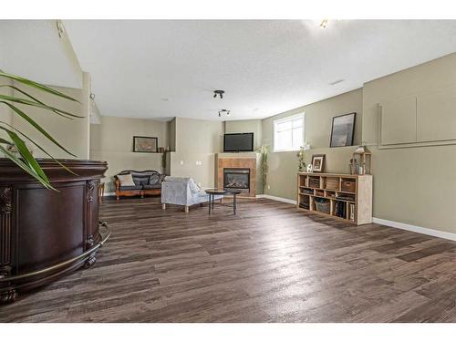 256 Sunset Heights, Crossfield, AB - Indoor With Fireplace