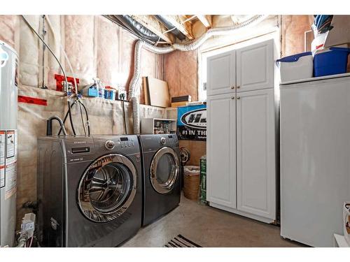 256 Sunset Heights, Crossfield, AB - Indoor Photo Showing Laundry Room