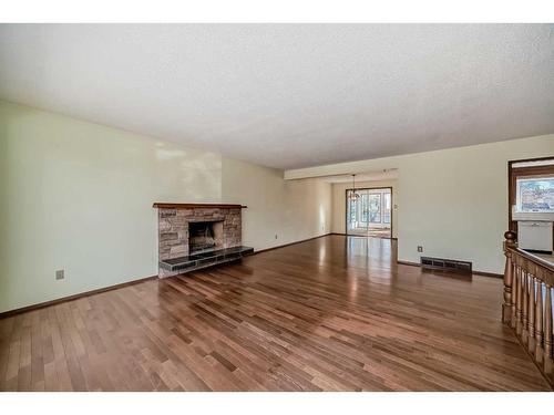 5872 Dalford Hill Nw, Calgary, AB - Indoor Photo Showing Living Room With Fireplace