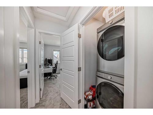 44 Heirloom Crescent Se, Calgary, AB - Indoor Photo Showing Laundry Room
