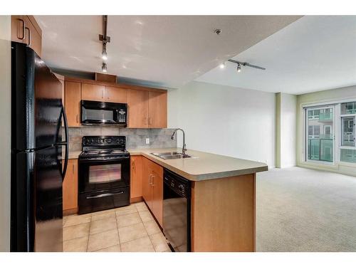 808-1410 1 Street Se, Calgary, AB - Indoor Photo Showing Kitchen With Double Sink