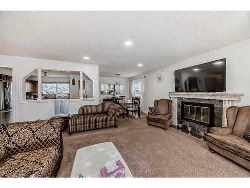 155 Maitland Drive Ne, Calgary, AB - Indoor Photo Showing Living Room With Fireplace