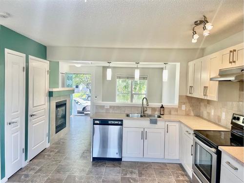 100 Auburn Bay Boulevard Se, Calgary, AB - Indoor Photo Showing Kitchen With Stainless Steel Kitchen With Double Sink