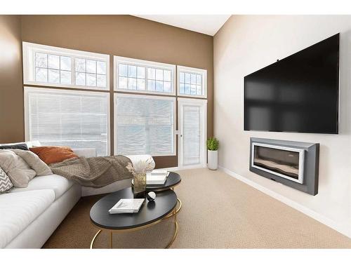 81-28 Heritage Drive, Cochrane, AB - Indoor Photo Showing Living Room With Fireplace